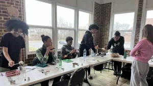 Homeschooled high school students at eXtend Homeschool Tutorial participate in a chemistry class